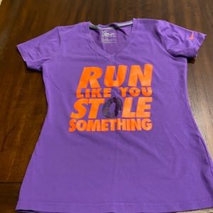 Nike dry fit workout shirt in size small. Purple shirt with orange writing.